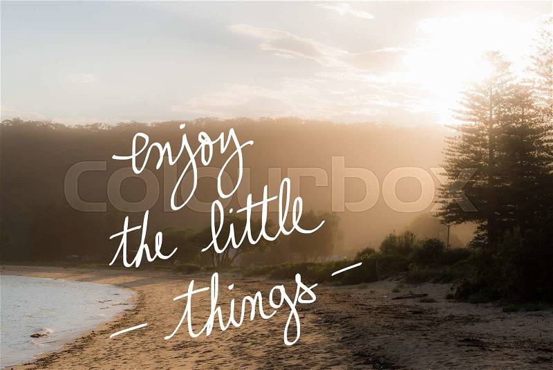 Enjoy The Little Things message. Handwritten motivational text over sunset calm sunny beach background with vintage filter applied, stock photo
