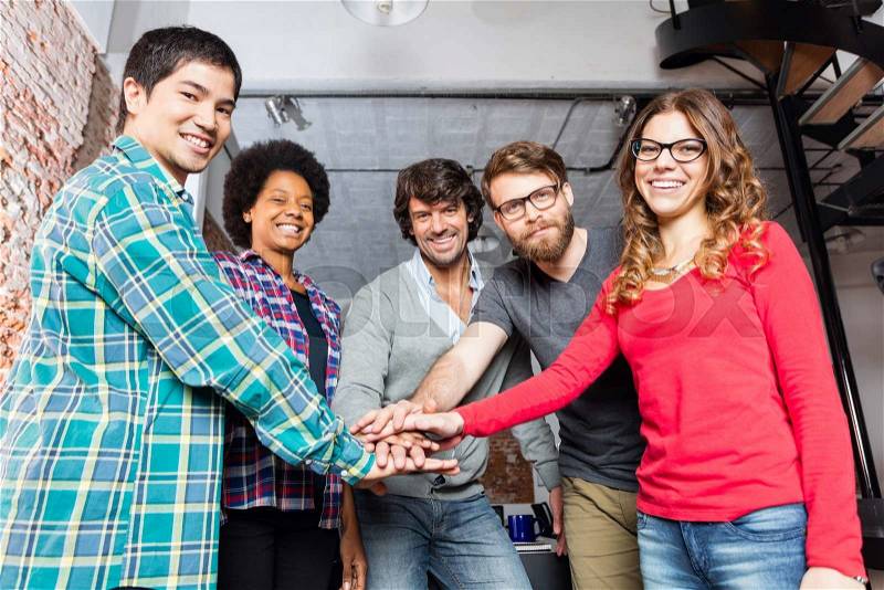 Diverse people team hands on top of each other support teamwork mix race group smile office, stock photo