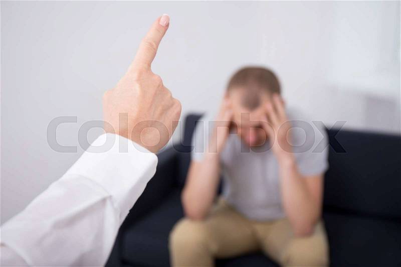 Dismissal concept - angry female boss firing bad worker in office, stock photo
