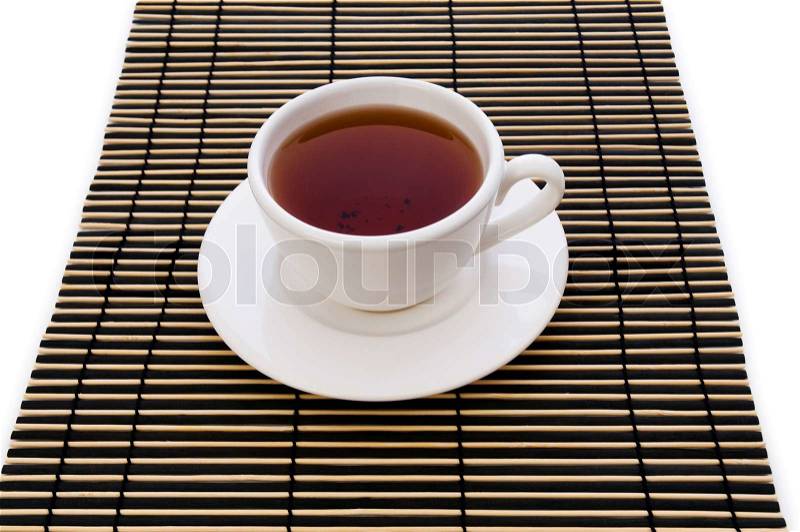 Cup of tea on striped mat, stock photo