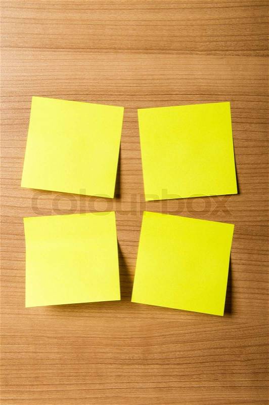 Many reminder notes on the wooden background, stock photo