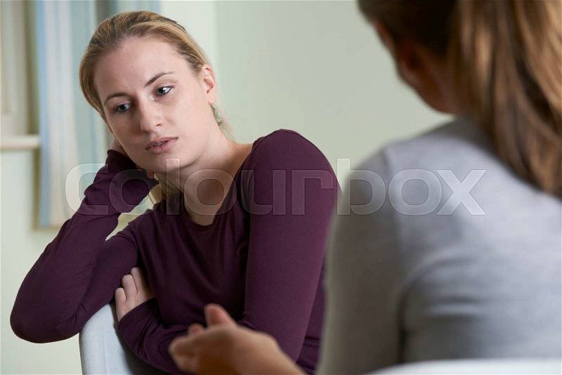 Young Woman Discussing Problems With Counselor, stock photo