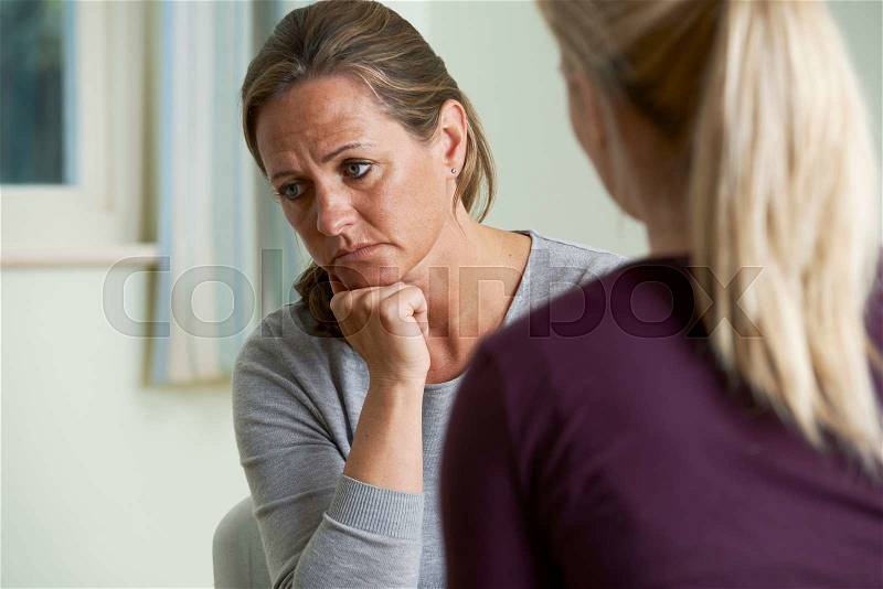 Mature Woman Discussing Problems With Counselor, stock photo