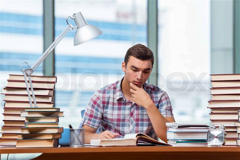 Young student preparing for college exams, stock photo