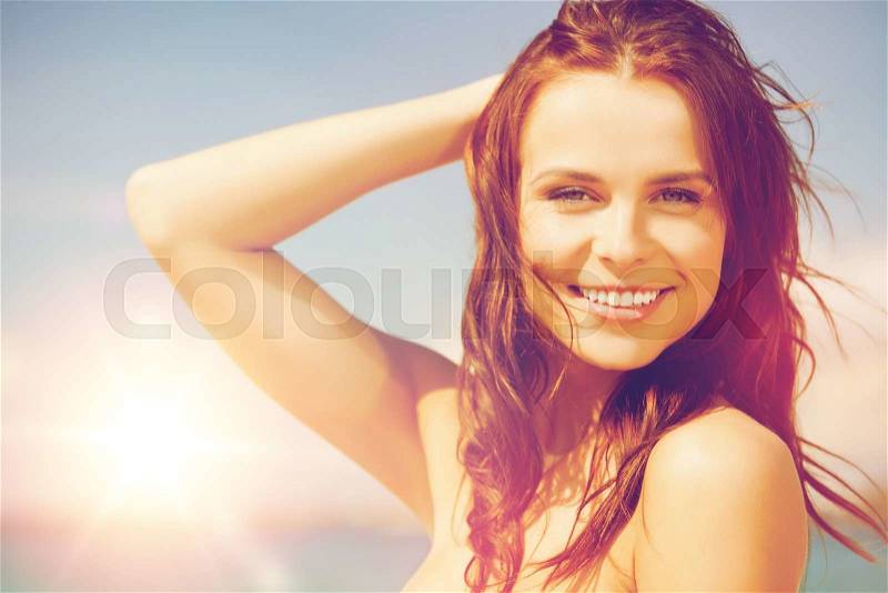 Close up of beautiful woman in bikini smiling, stock photo
