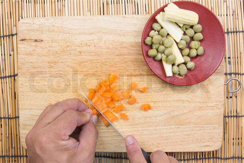 Chef cutting carrot for cooking fired rice / cooking fire rice concept, stock photo