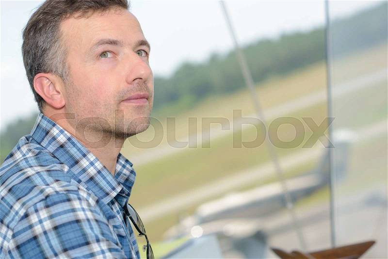 Closeup of man in control tower, stock photo