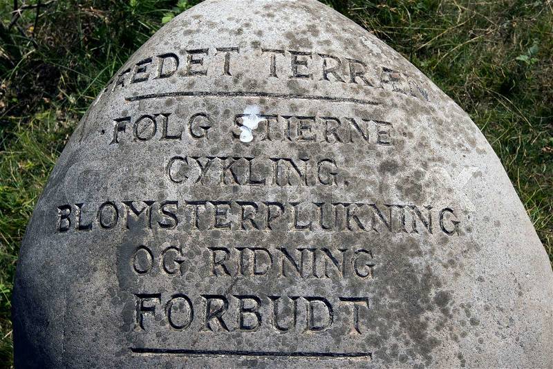 Engraved stone. Preserved terrain.Follow the paths. Cycling, flower picking and horse riding prohibited, stock photo