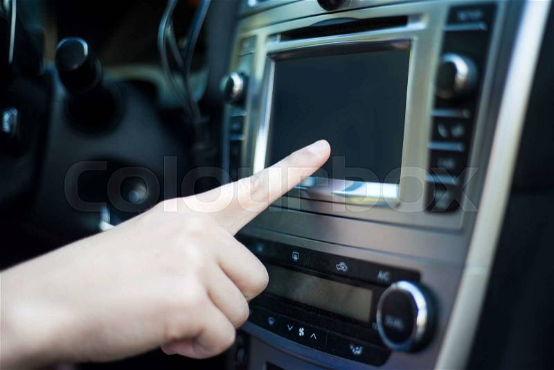 Male hand touching blank screen in modern car