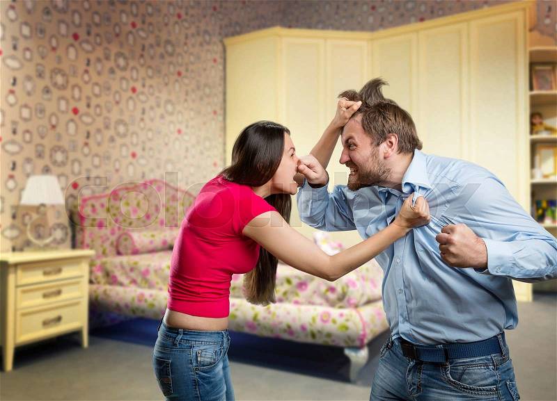 Man and woman are fighting at home, stock photo