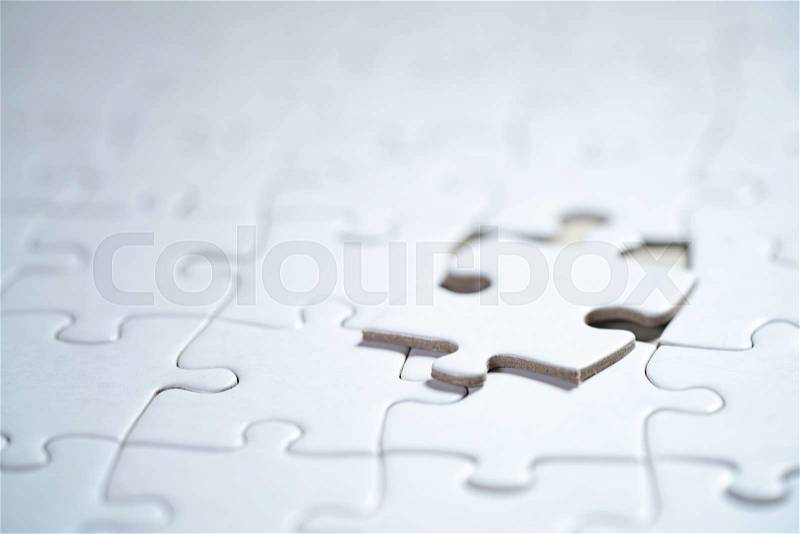 White Blank jigsaw puzzle, business concept of Solution with clipping path, shallow DOF, stock photo