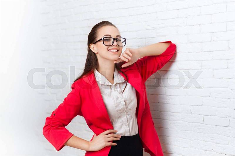 Businesswoman happy smile wear red jacket glasses business woman over office wall, stock photo