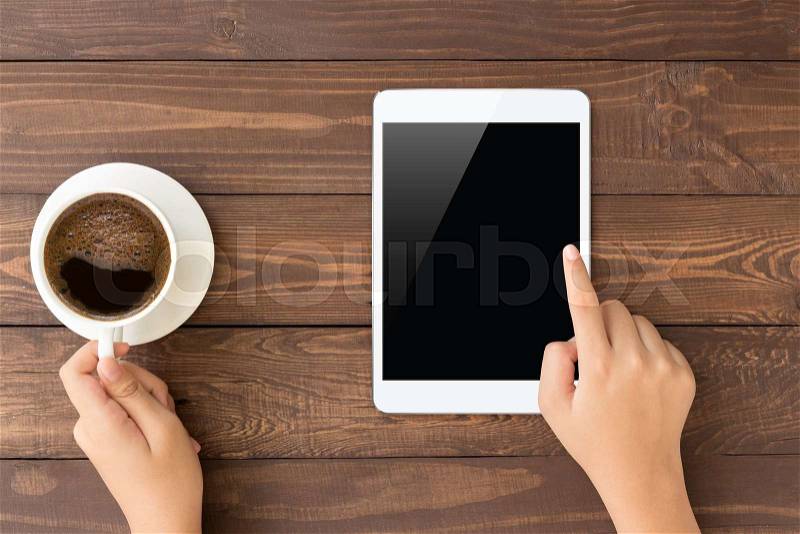 Female touch on white tablet blank screen on top view , stock photo
