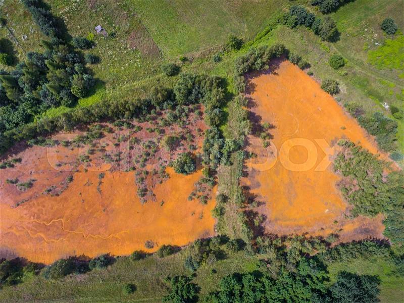 Old sulfuric acid natural tank orange color in south of Poland. , stock photo