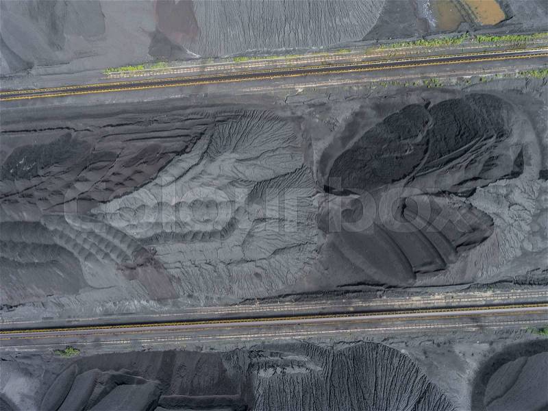 Mining excavator on the bottom surface mine. Brown coal deposits. View from above, stock photo