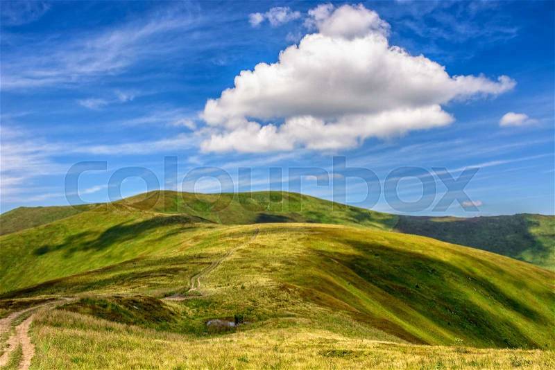 Mountain landscape. travers path through hill side to the mountain top, stock photo