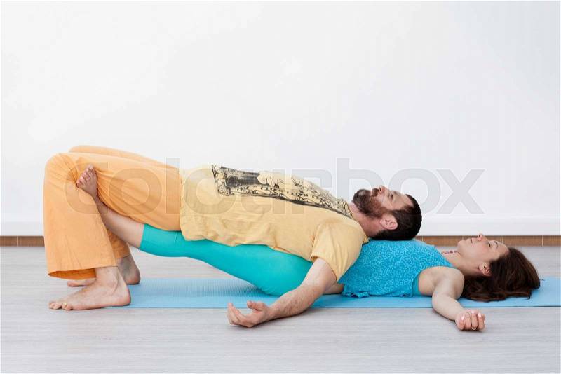 Pair exercises. Stretching. A man and a woman are performing thai massage, stock photo