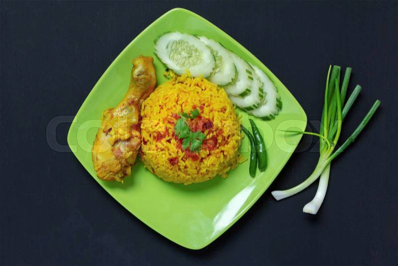 Top view, Chicken Biryani thai style. halal food (Khao Mok Gai). on black background, stock photo