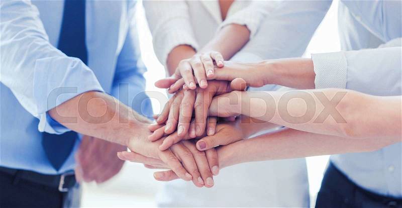 Success and winning concept - happy business team celebrating victory in office, stock photo