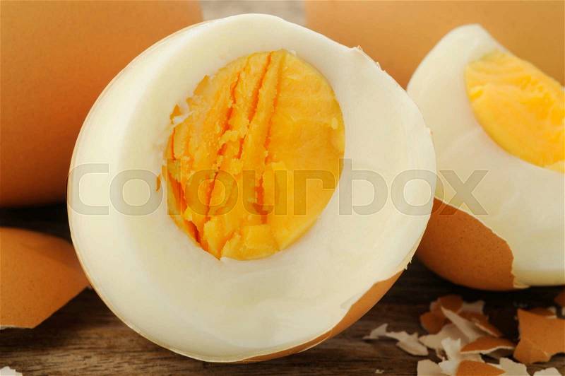 Egg boiled on old wooden background, stock photo