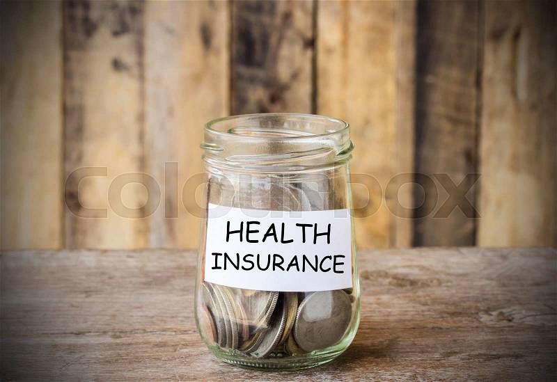 Save money for HEALTH INSURANCE, concept money in the glass with filter effect retro vintage style, stock photo