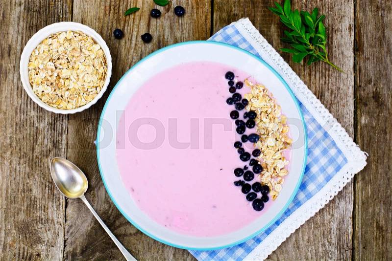 Smoothie with Blueberries, Oatmeal on Brown Boards Studio Photo, stock photo