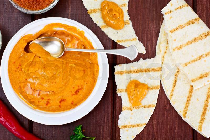 Hummus with Curry, Turmeric, Raw Chickpeas on the Boards Studio Photo, stock photo
