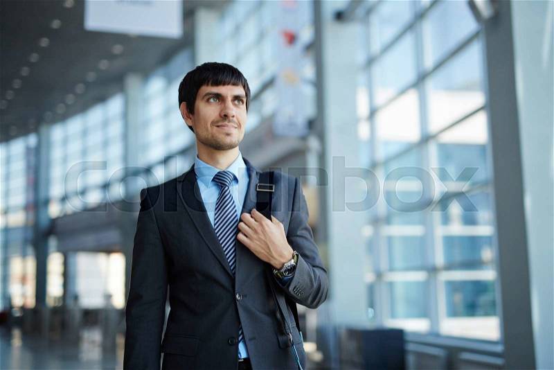 Elegant businessman in business center, stock photo