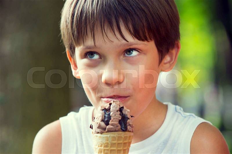 Boy and dad eating ice cream, stock photo