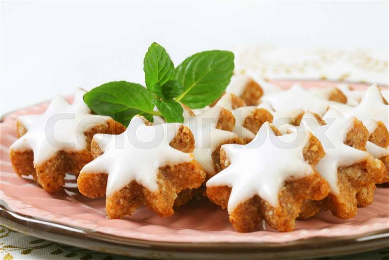 Cinnamon star cookies glazed with frosting, stock photo