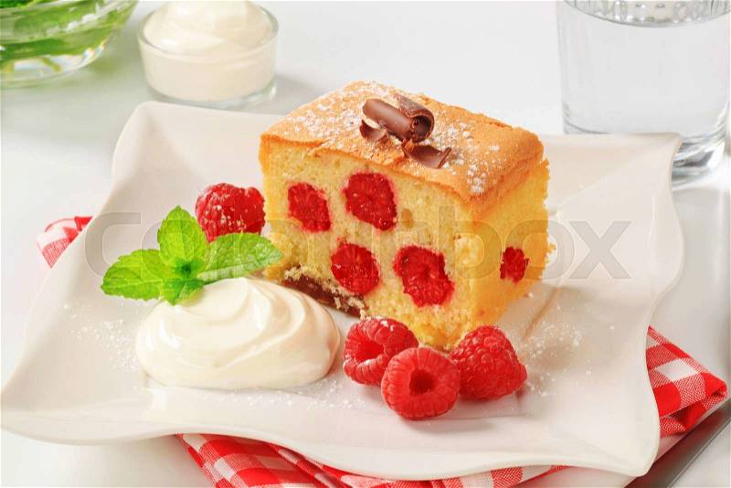 Raspberry sponge cake with sour cream, stock photo