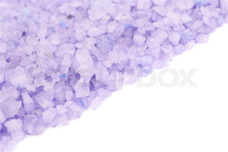 Pile of salt crystals isolated over the white background, close-up crop fragment as a copyspace backdrop composition, stock photo