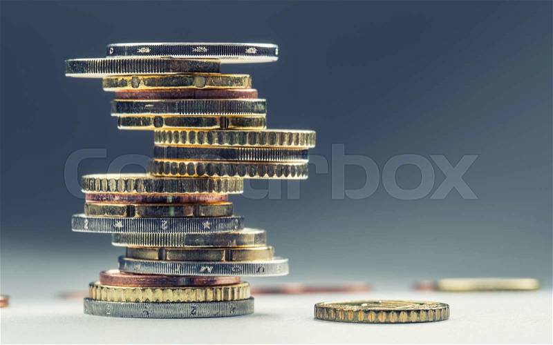 Euro coins. Euro money. Euro currency.Coins stacked on each other in different positions. Money concept, stock photo