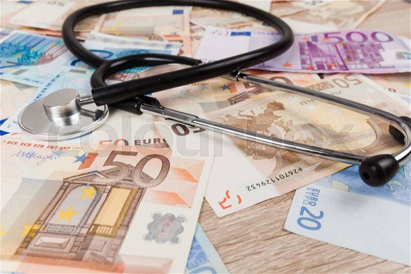 Euro banknotes and stethoscope. Health care cost. medical concept, stock photo
