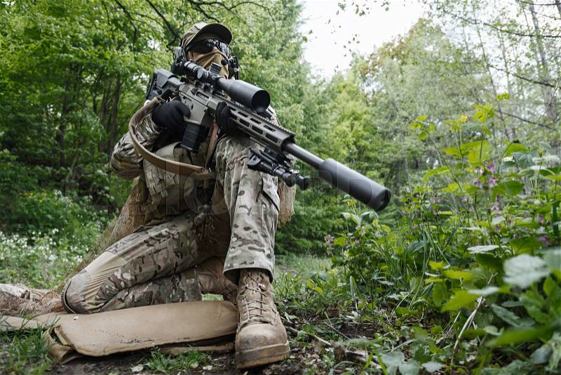 Green Berets US Army Special Forces Group sniper in action, stock photo