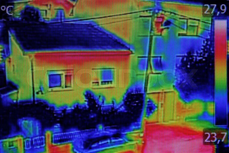 Infrared thermovision image showing lack of thermal insulation on Residential building, stock photo