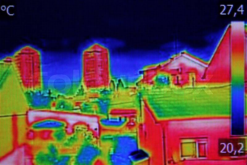 Infrared thermovision image showing lack of thermal insulation on Residential building, stock photo