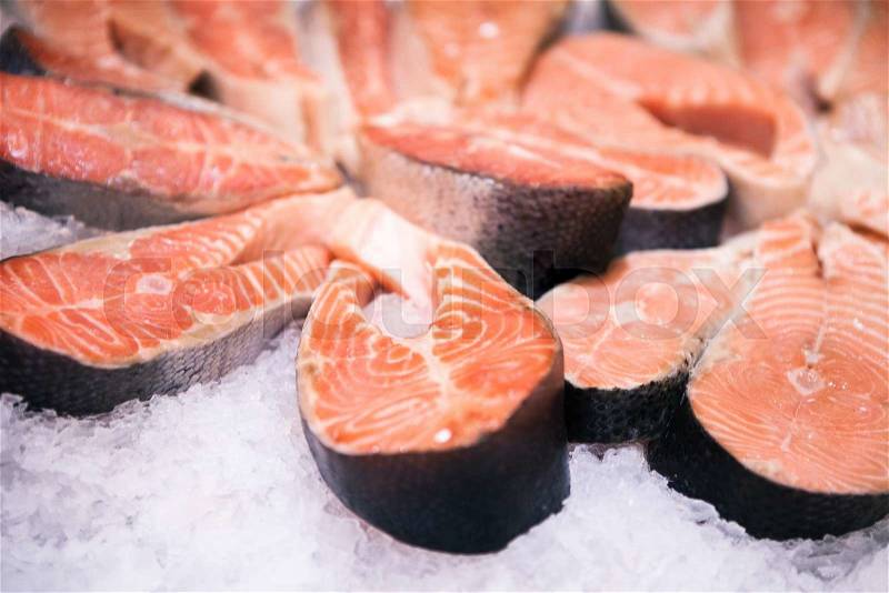 Fresh salmon with ice sold at local farm market, stock photo