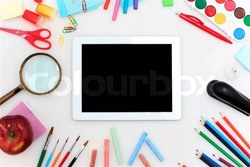 School set with back to school inscription, notebooks, tablet, pencils, brush, scissors and apple on white background, stock photo