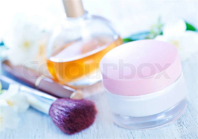 Cream for body in bank and on a table, stock photo