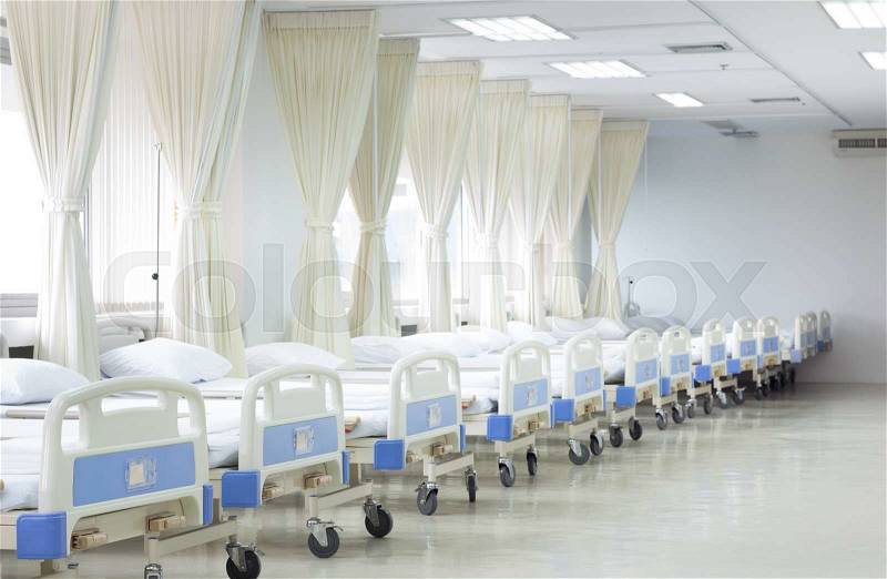 Hospital ward with beds and medical equipment, interior of new empty hospital room, stock photo