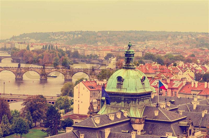 Center of Prague city at autumn with red roofs, european travel landscape background in vintage style, stock photo