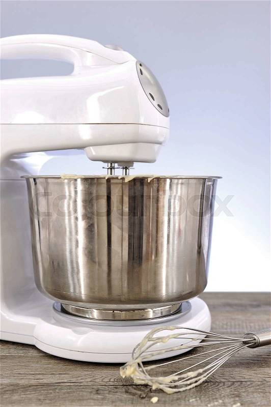 A studio photo of an electrical food mixer, stock photo