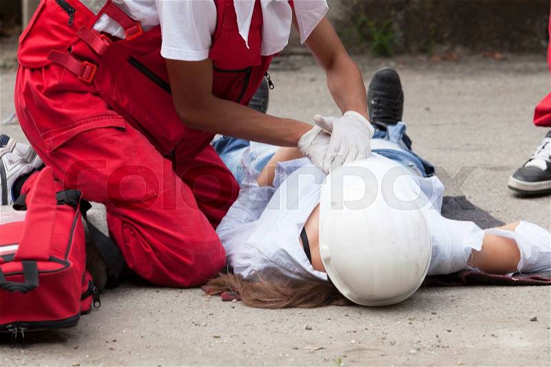 Workplace accident - First aid after occupational injury, stock photo