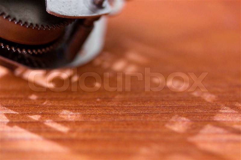 Orange background with a metal mechanism in the corner. Add your text to the background, stock photo