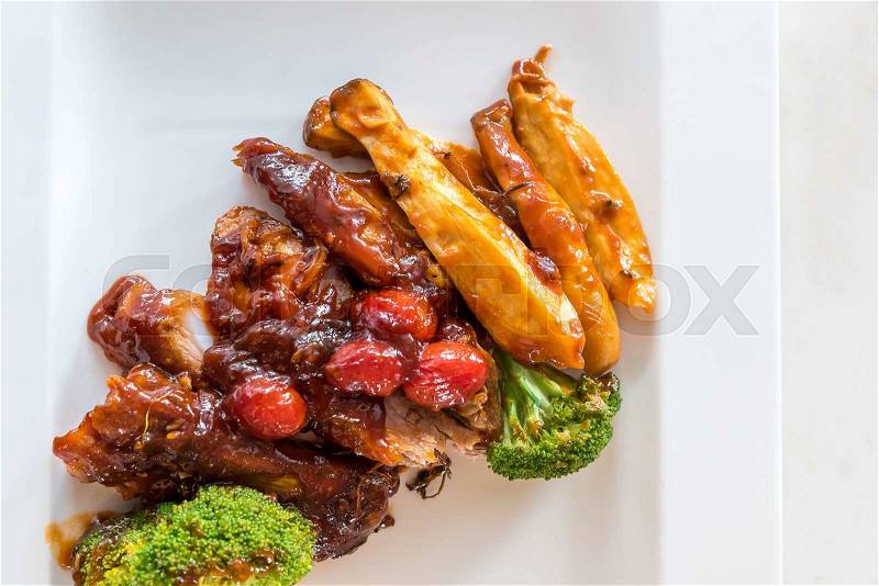 Pork Rib Grilled and Fried Potato Wedges on White Plate with Sauce and Veggies, Gourmet cuisine, stock photo