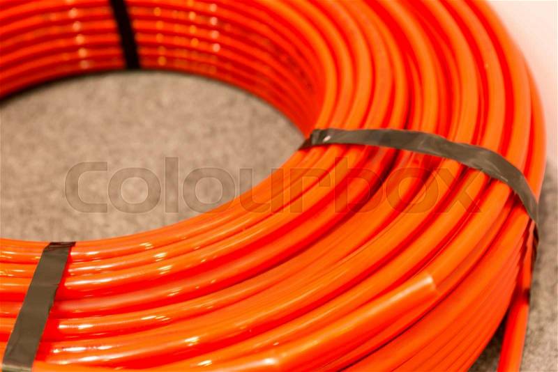 Closeup view of red plastic pipe, stock photo