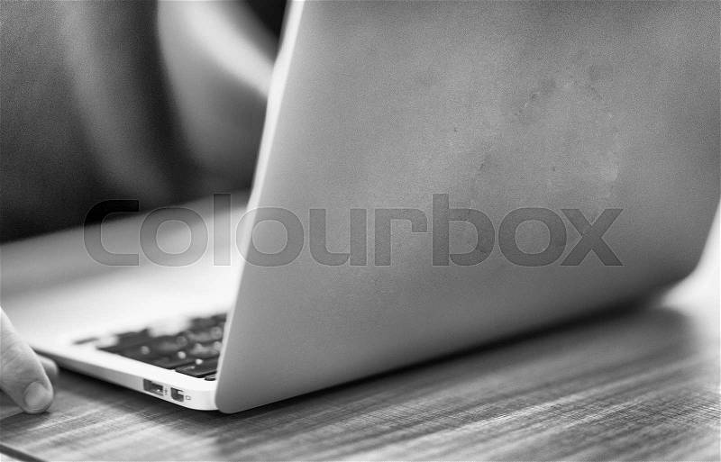 Man with laptop on the table, stock photo