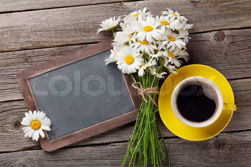 Blackboard for your text, flowers and coffee cup. Top view with copy space, stock photo