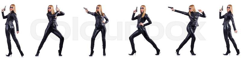Woman in leather costume with gun isolated on white, stock photo